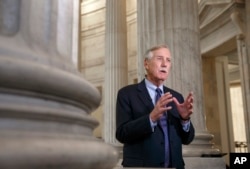 FILE - Sen. Angus King, I-Maine, is interviewed on Capitol Hill in Washington, Dec. 9, 2014.
