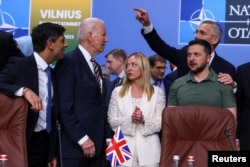 FILE - Ukraine's President Volodymyr Zelenskyy, British Prime Minister Rishi Sunak, U.S. President Joe Biden, Italian Prime Minister Giorgia Meloni and NATO Secretary-General Stoltenberg attend a meeting of the NATO-Ukraine council, in Vilnius, Lithuania, July 12, 2023.