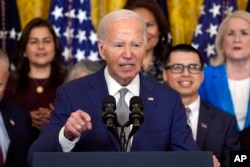 FILE - President Joe Biden speaks in the East Room of the White House, June 18, 2024.