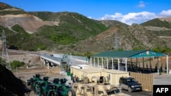 FILE - A view of an Azerbaijani checkpoint at the entry of the Lachin Corridor, the Armenian-populated breakaway Nagorno-Karabakh region's only land link with Armenia, by a bridge across the Hakari River, May 2, 2023.