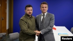 FILE - Ukraine's President Volodymyr Zelenskyy and French President Emmanuel Macron pose for a picture during a meeting on the sidelines of the European Political Community Summit in Granada, Spain Oct. 5, 2023.