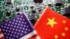 FILE - Flags of the U.S. and China are displayed against the backdrop of a circuit board with semiconductor chips, in this illustration photo taken Feb. 17, 2023. 