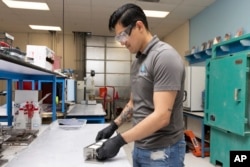 Jesus Gonzalez Pequeno works in the product lab at Fortera's facility in San Jose, Calif., Wednesday, April 10, 2024. (AP Photo/Benjamin Fanjoy)