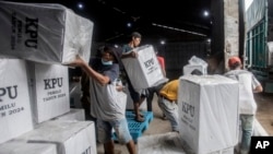 Workers load ballot boxes onto a truck to be distributed to polling stations ahead of Feb. 14 elections, in Medan, North Sumatra, Indonesia, Feb. 12, 2024. 