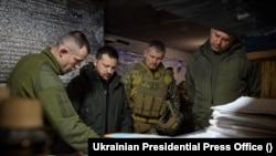 FILE — Ukrainian President Volodymyr Zelenskyy in Donetsk region of Ukraine, Dec. 29, 2023. Journalists are starting to question whether the United TV Marathon, which offers 24/7 coverage of the war in Ukraine, still offers value. Zelenskyy was recently asked about its relevancy.