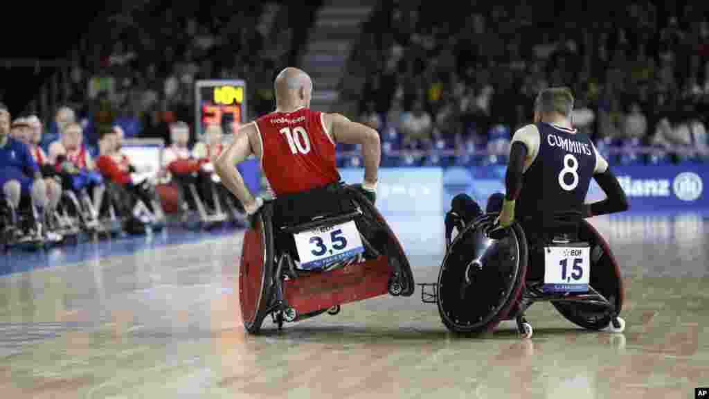 Denmark's Sebastian Frederiksen, left, makes contact with Britain's Nick Cummins during a preliminary-round wheelchair rugby match at the Paralympic Games in Paris.