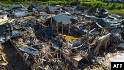 Picha ya majengo yalioharibiwa na mvua kubwa zinazoendelea kunyesha China.Picha ya maktaba Juni 21, 2024.