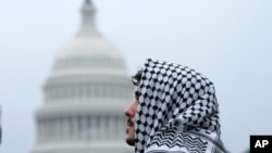 A man wearing a keffiyeh attends a pro-Palestinian rally near the U.S. Capitol in Washington, May 18, 2024.