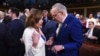 FILE - Then-House Speaker Nancy Pelosi, left, and Senate Majority Leader Chuck Schumer speak before President Joe Biden delivers the State of the Union address to a joint session of Congress at the Capitol, March 7, 2024, in Washington. 