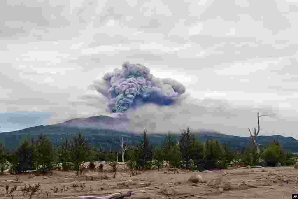 In this photo taken from AP video, provided by by the Institute of Volcanology and Seismology of the Far Eastern Branch of the Russian Academy of Sciences, the eruption of the Shiveluch volcano is seen on Russia's Kamchatka Peninsula.