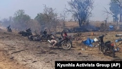This photo provided by the Kyunhla Activists Group shows aftermath of an airstrike in Pazigyi village in Sagaing Region's Kanbalu Township, Myanmar, Tuesday, April 11, 2023. Witnesses and independent media reports said dozens of villagers in central Myanmar have been killed in an air attack carried out Tuesday by the Southeast Asian country's military government. (Kyunhla Activists Group via AP)