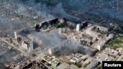 A drone view shows damaged buildings, amid Russia's attacks on Ukraine, in Vovchansk, Kharkiv region, Ukraine, in this screen grab from video released on June 2, 2024. (United Assault Brigade of the National Police of Ukraine "Lyut"/Handout via Reuters)