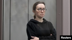 FILE - Alsu Kurmasheva, a journalist with Radio Free Europe/Radio Liberty who is in custody after she was accused of violating Russia's law on foreign agents, attends a court hearing in Kazan, Russia, Feb. 1, 2024.