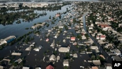 Streets are flooded in Kherson, Ukraine, June 7, 2023 after the walls of the Kakhovka dam collapsed. 