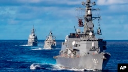 কোয়াড দেশগুলোর যৌথ নৌ মহড়া 'মালাবার ২০২১'-এ জাপান, ভারত, অস্ট্রেলিয়া আর যুক্তরাষ্ট্রের নৌজাহাজ অংশ নেয়। ফাইল ফটোঃ ২৭ অগাস্ট, ২০২১।