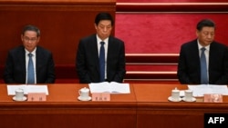 左起：李強、栗戰書和習近平在北京人大會堂出席全國政協會議開幕式 (2023年3月4日)