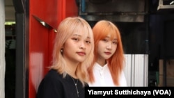 young political activists Tantawan "Tawan" Tuatulanon (left) and Orawan "Bam" Phuphong (right)