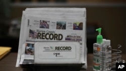 A printed issue of the Marion County Record sits on display at the newspaper's office, in Marion, Kansas, Aug. 13, 2023.