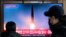 FILE - A TV screen shows a file image of a North Korean missile launch during a news program at the Seoul Railway Station in Seoul, South Korea, Dec. 18, 2023.