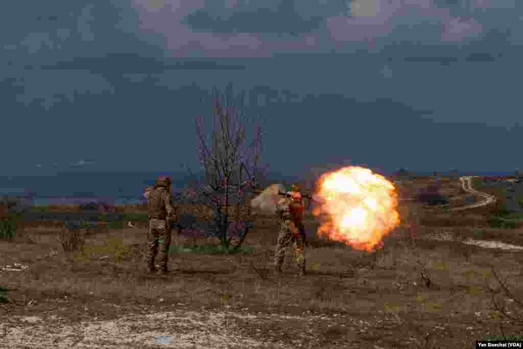 A Ukrainian soldier fires a RPG in a training camp just outside of Siversk, one of the many towns in the Donbas region badly affected by the war, April 4, 2023. 