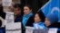 Activists and community members protest outside the British Foreign Office in London, Feb. 13, 2023. They sought a meeting with the foreign secretary to highlight concerns for their compatriots in the Chinese Xinjiang Uyghur Autonomous Region.