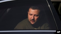 Ukraine's President Volodymyr Zelenskyy is seen in a car during a visit at a military air base in Soesterberg, Netherlands, May 4, 2023. 