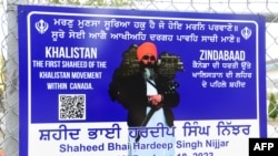 FILE - A poster of the former Gurdwara President Hardeep Singh Nijjar is displayed on a fence outside the Guru Nanak Sikh Gurdwara temple in Surrey, British Columbia, Canada, on Sept. 19, 2023.