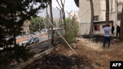 Персоналот на Агенцијата за помош и работа на Обединетите нации за палестинските бегалци (УНРВА) го посети нивното седиште во источен Ерусалим каде што се видливи трагите од пожар по пожарот на периметарот на зградата на 10 мај 2024 година.