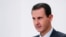 FILE - Syria's Bashar al-Assad speaks in Damascus, Nov. 9, 2019. A Paris court on May 24, 2024, found three Syrians guilty of war crimes and crimes against humanity in the deaths of two French nationals. Assad's regime has long been accused of committing atrocities. (SANA via AP)