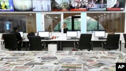 Newspapers rest on a table at a private television broadcaster in Algiers, Algeria, March 19, 2024.