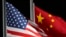 FILE - The American and Chinese flags wave at Genting Snow Park, Feb. 2, 2022, in Zhangjiakou, China. Most U.S. businesses surveyed by the American Chamber of Commerce in China expressed pessimism about the investment climate there going forward.