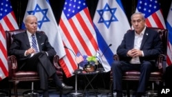 U.S. President Joe Biden, left, and Israeli Prime Minister Benjamin Netanyahu are pictured during their meeting in Tel Aviv, Israel, Oct. 18, 2023.