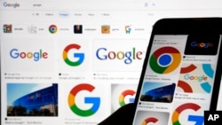 FILE - Google logos pop up in a search in New York, Sept. 11, 2023. Google said Aug. 14, 2024, that an Iranian group had tried to infiltrate personal email accounts of roughly a dozen people linked to President Joe Biden and former President Donald Trump since May.