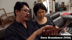 Loh Teng Shui, left, and his wife Tan Ei Ein, lost their only child, Zech, 7, in the December 2022 landslide. The couple says they want the Malaysian government to take steps to prevent a similar tragedy from happening again. 