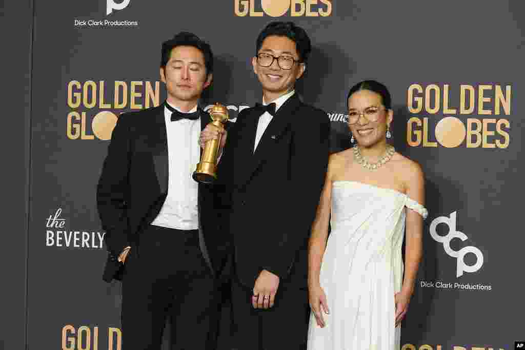 Steve Yeun, from left, Lee Sung Jin, and Ali Wong pose in the press room with the award for best television limited series, anthology series or motion picture made for television for "Beef" at the 81st Golden Globe Awards on Jan. 7, 2024,&nbsp;