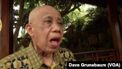 Hotib practices speaking. A cancer diagnosis led to his larynx being removed after smoking for almost four-decades.