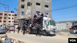 In photos: Gaza families search for haven to wait out the war
