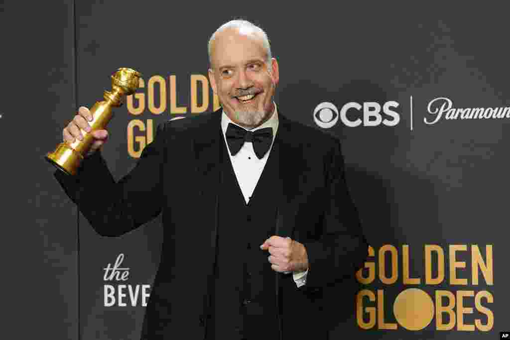 Paul Giamatti poses in the press room with the award for best performance by an actor in a motion picture, musical or comedy for "The Holdovers" at the 81st Golden Globe Awards on Jan. 7, 2024,