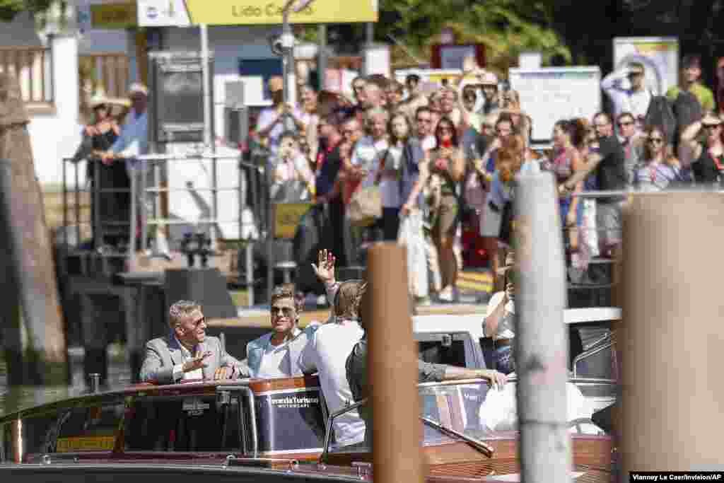 George Clooney, left, and Brad Pitt arrive for the press conference of the film 'Wolfs' during the 81st edition of the Venice Film Festival in Venice, Italy.