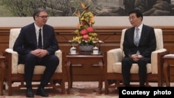 2023年10月17日塞爾維亞共和國總統武契奇在北京會見王滬寧。