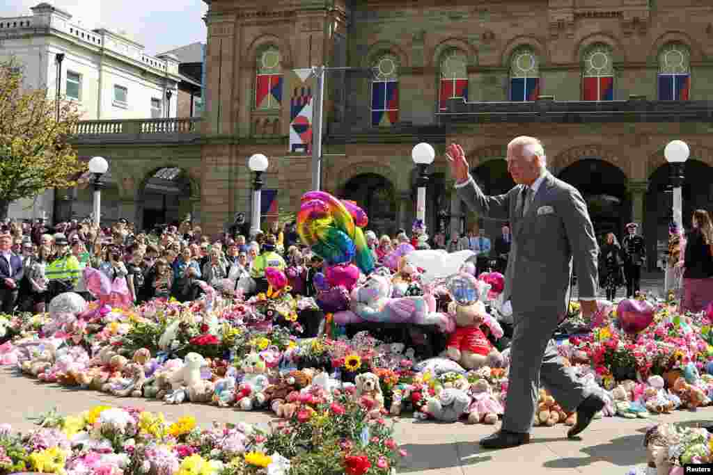 Britain's King Charles makes a community visit, in the aftermath of a mass stabbing which sparked riots and racist attacks targeting Muslims and migrants, outside the Town Hall in Southport.