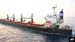 FILE - This Indian navy photo shows the U.S.-owned Genco Picardy, which was attacked Jan. 17, 2024, in the Gulf of Aden by a bomb-carrying drone launched by Houthi rebels. The U.S. military pounded Houthi missile launchers in Yemen on Jan. 19, the sixth such strike in a week.