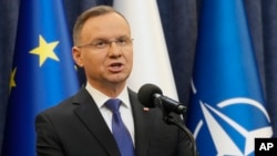 FILE - Poland's President Andrzej Duda gives a statement to the media in Warsaw, Poland, Jan. 10, 2024. Poland’s president is calling on other other members of the NATO alliance to raise their spending on defense to 3% of their GDP.