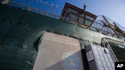 FILE - In this photo reviewed by U.S. military officials, the control tower of Camp VI detention facility is seen on April 17, 2019, at Guantanamo Bay Naval Base, Cuba.