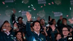 FILE - Taiwanese Vice President Lai Ching-te, also known as William Lai, left, celebrates his victory with running mate Bi-khim Hsiao, right, in Taipei, Taiwan, Jan. 13, 2024.