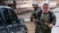 FILE - Christian fighters of Sutoro carry their weapons at a checkpoint in Tel Tamr, Syria, Feb. 25, 2015. Local reports said three members of Sutoro were killed in Turkish drone strikes on Derik, Syria, Feb. 28, 2024.
