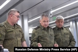 In this photo released on June 26, 2023 by the Russian Defense Ministry Press Service, Russian Defense Minister Sergei Shoigu, center, inspects a command post at an undisclosed location. (Russian Defense Ministry Press Service via AP)