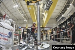Scientists from the Antihydrogen Laser Physics Apparatus (ALPHA) project in Geneva, Switzerland carry out experiments on antimatter. (Image Credit: European Center for Nuclear Research/CERN)