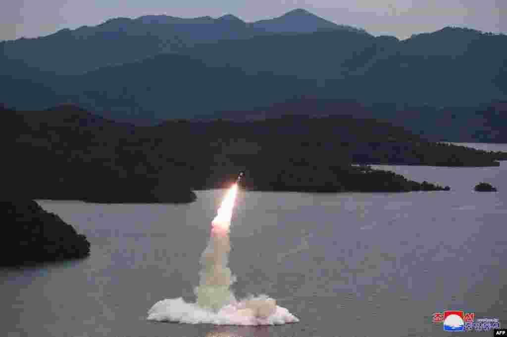 This undated picture released from North Korea's official Korean Central News Agency (KCNA) shows a Hokkaido missile launch training test by the Korean People's Army Tactical Nuclear Operation Unit at an undisclosed location.