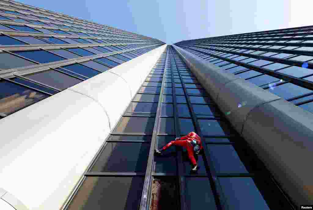 French "Spiderman" Alain Robert climbs Montparnasse Tower to highlight the fuel and energy crisis, amid weeks-long union-led blockades of petrol depots in the country, in Paris, France.
